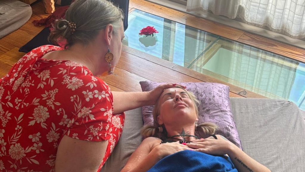 Students receiving their certificates after completing an accredited womb healing training course, ready to begin their healing practice.