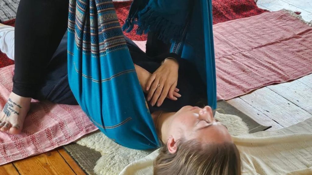 Women gathered in a sacred circle during a womb healing training, learning ancient practices to reconnect with feminine energy and womb wisdom.