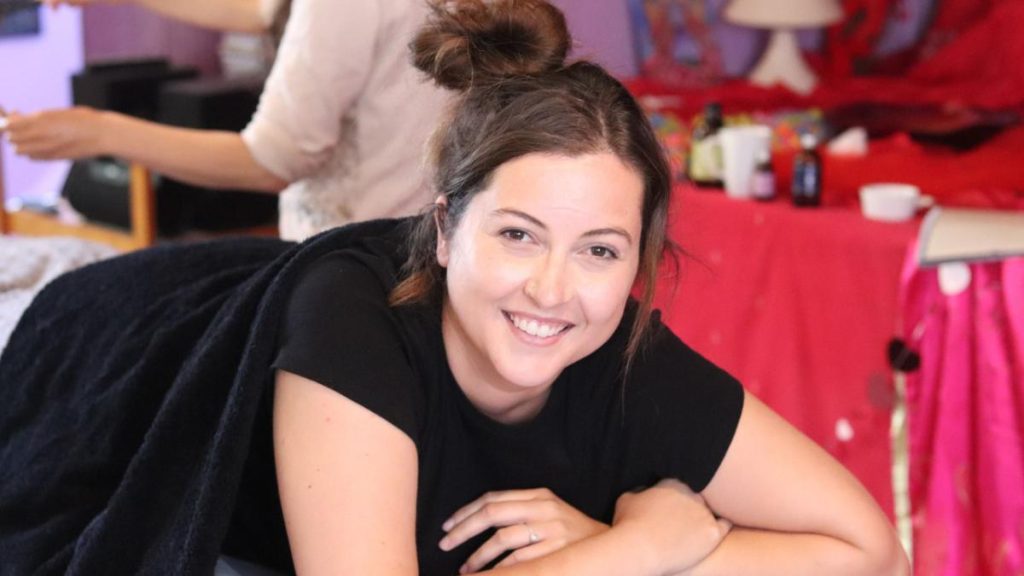 Holistic practitioner learning womb massage techniques