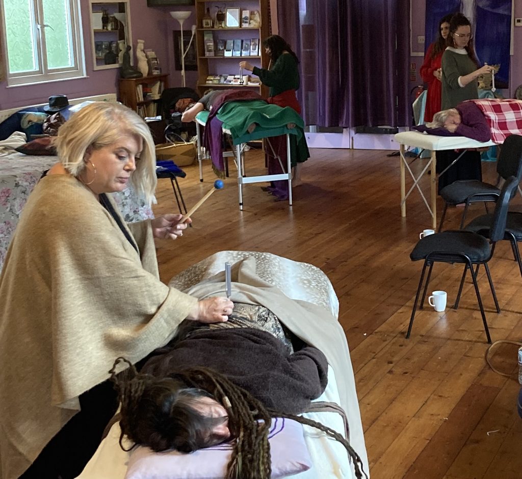 Womb Healing with tuning forks during practitioner training at the Sanctuary of Sophia